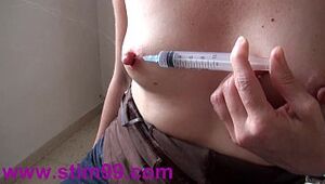Squirting Saline by Nipple and Extreme Needles Pierced